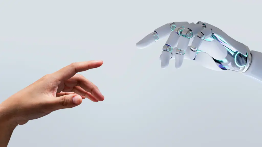 A human hand reaches toward a robotic hand, symbolizing trusted collaboration between humans and artificial intelligence for creating reliable, high-quality content.