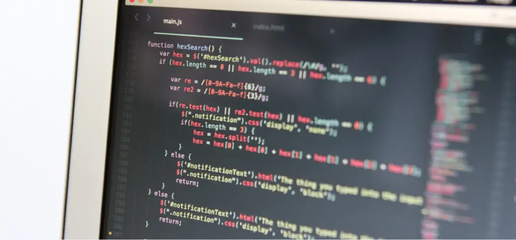 A laptop screen displaying lines of JavaScript code inside a code editor. Below the image, the text reads: 'Engineering Websites for LLM Scrapers'.