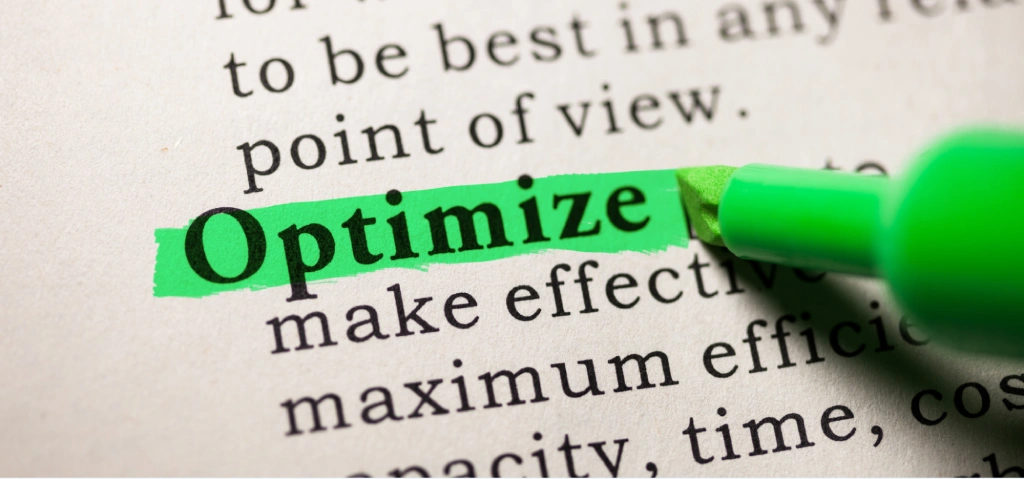 A close-up of a dictionary page where the word 'Optimize' is highlighted with a bright green marker. Below the image, the text reads: 'Optimizing Entity Hierarchies and Codebases'.
