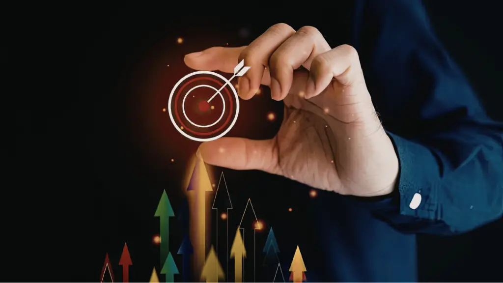 Resolving Channel Conflicts in Multi-Region Targeting A hand holding a glowing digital bullseye target icon with an arrow in the center, positioned above a cluster of upward-pointing colored arrows against a dark background.