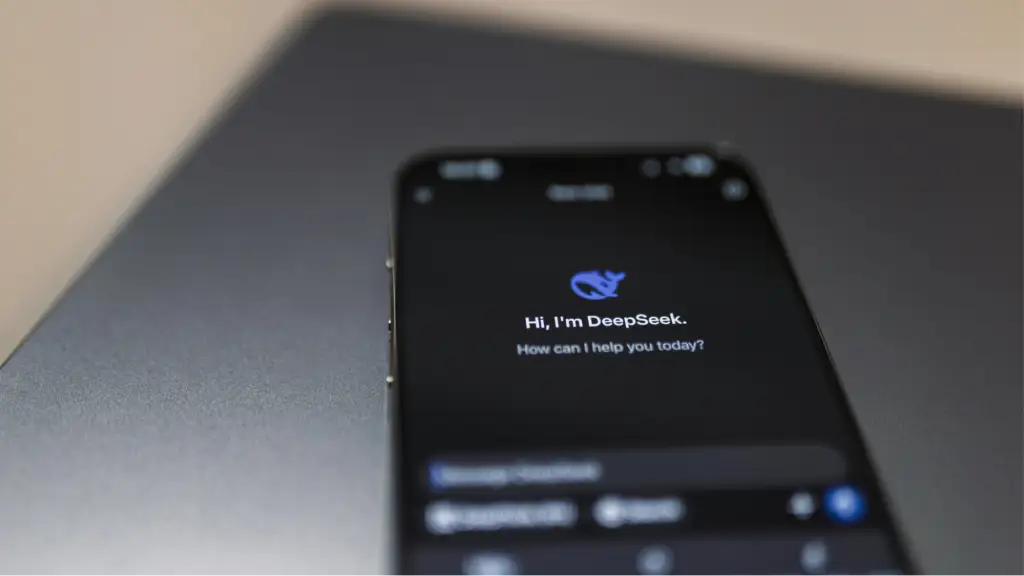 A smartphone displays the DeepSeek AI interface, representing AI-powered search, conversational assistants, and the evolving landscape of AI search visibility.