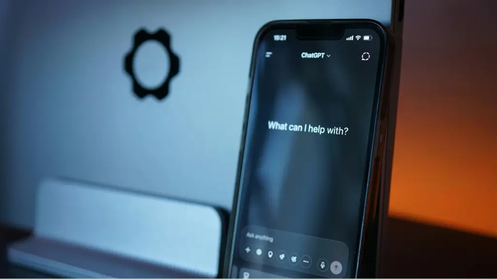 A smartphone displays the ChatGPT interface against a blurred background, representing generative AI technology, conversational search, and the growing role of AI-powered information retrieval.