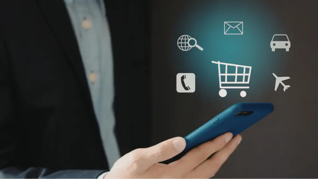 A person uses a smartphone with shopping and communication icons, representing ecommerce, online shopping, and the importance of PPC advertising for digital businesses.